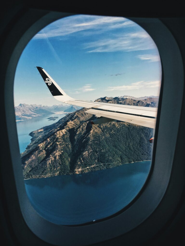 Stunning aerial view of mountains and sea from an airplane window.